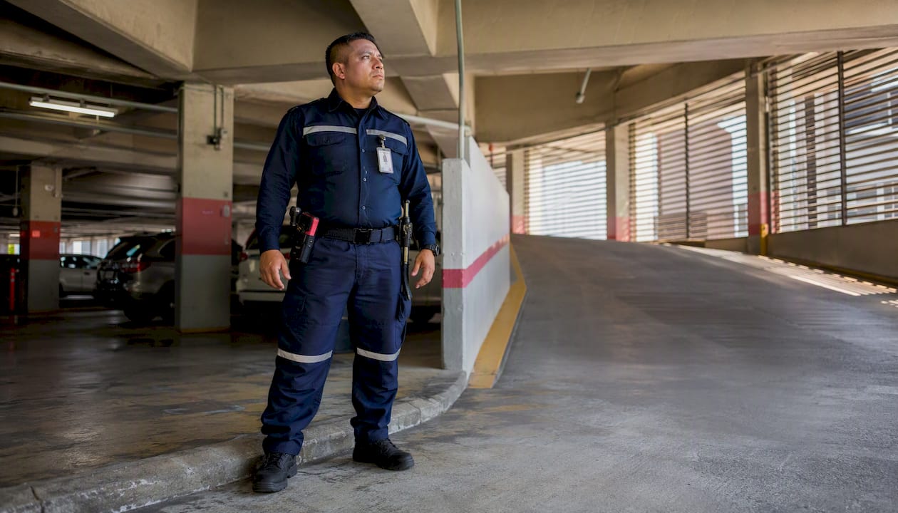 Security guard on foot patrol in parking garage