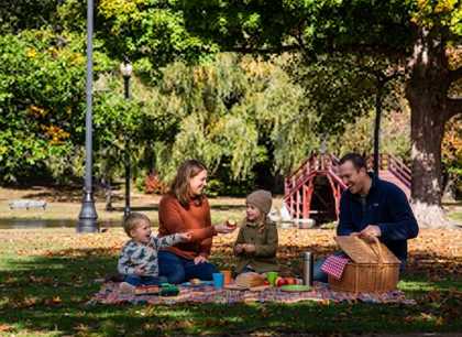 Family picnicking in a park in Worcester, Massachusetts