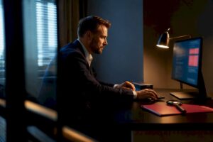 Investigator reviewing executive background information