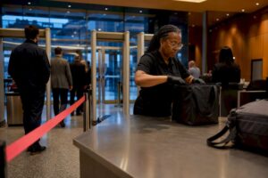 Organized event entrance with bag screening lanes