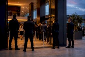 Security team managing crowded event entrance